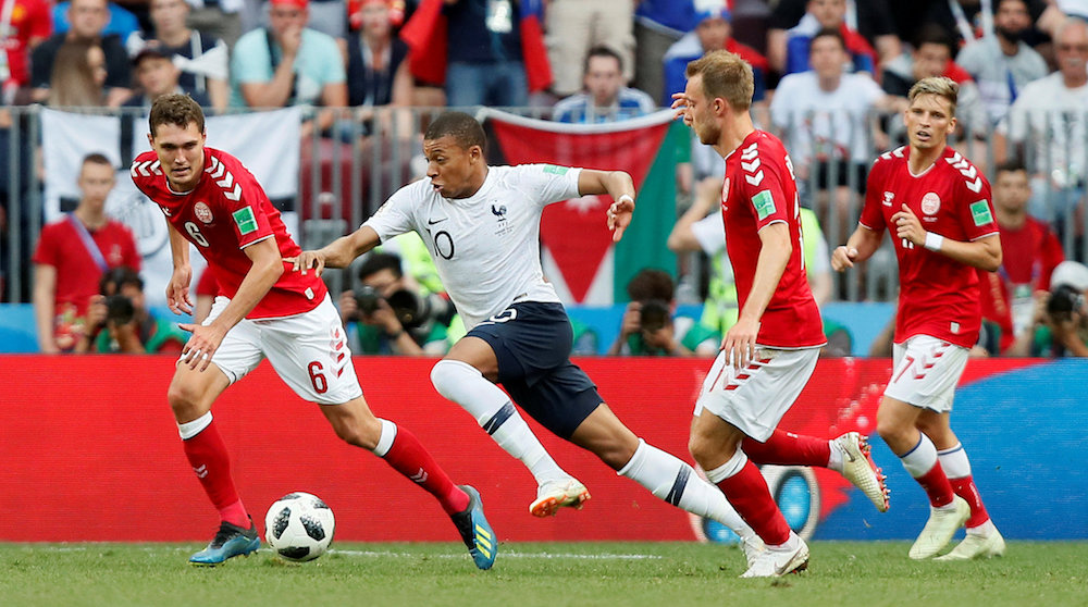 Franceu00e2u20acu2122s Kylian Mbappe in action with Denmarku00e2u20acu2122s Andreas Christensen and Christian Eriksen at the 2018 Fifa World Cup in Moscow June 26, 2018. u00e2u20acu201d Reuters pic