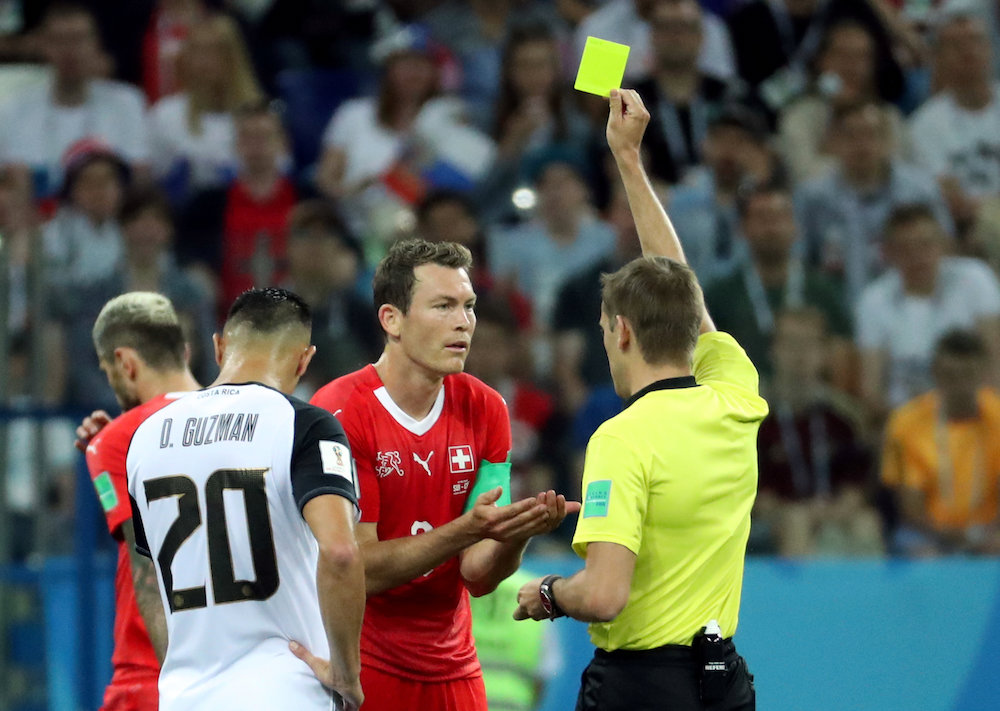 Switzerlandu00e2u20acu2122s Stephan Lichtsteiner is shown a yellow card by referee Clement Turpin during the match against Costa Rica at the 2018 Fifa World Cup in Nizhny Novgorod June 27, 2018. u00e2u20acu201d Reuters pic