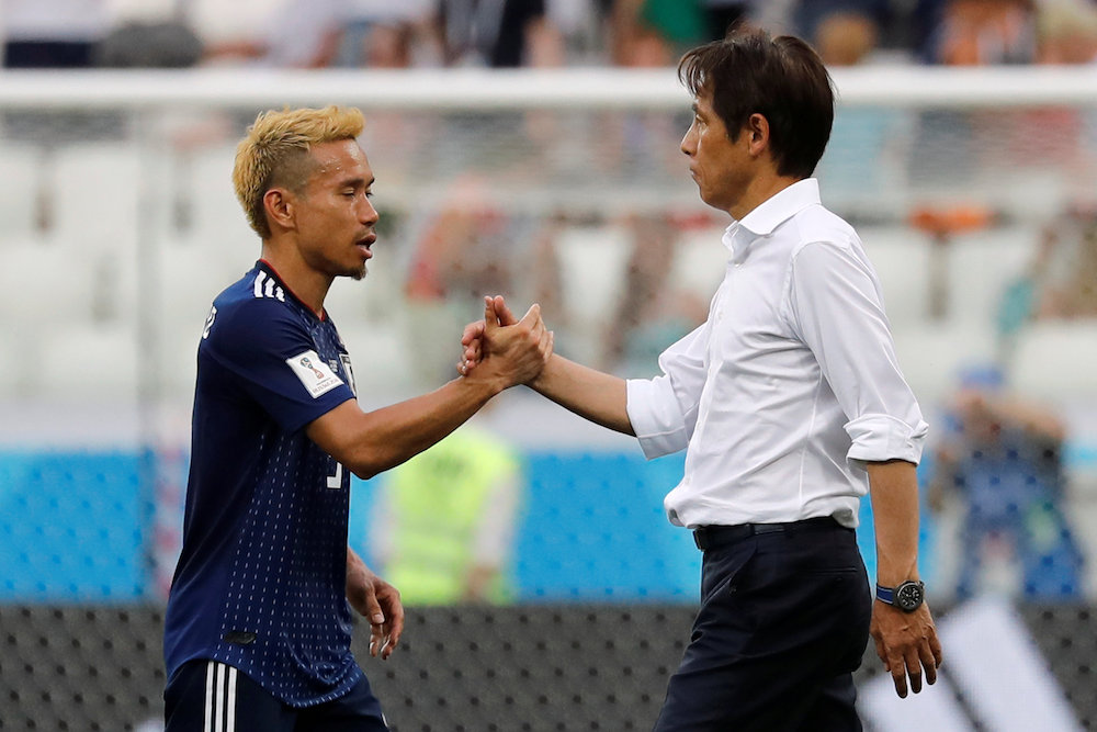 Japan coach Akira Nishino shakes hands with Yuto Nagatomo after the 2018 Fifa World Cup match against Poland in Volgograd June 28, 2018. u00e2u20acu201d Reuters pic