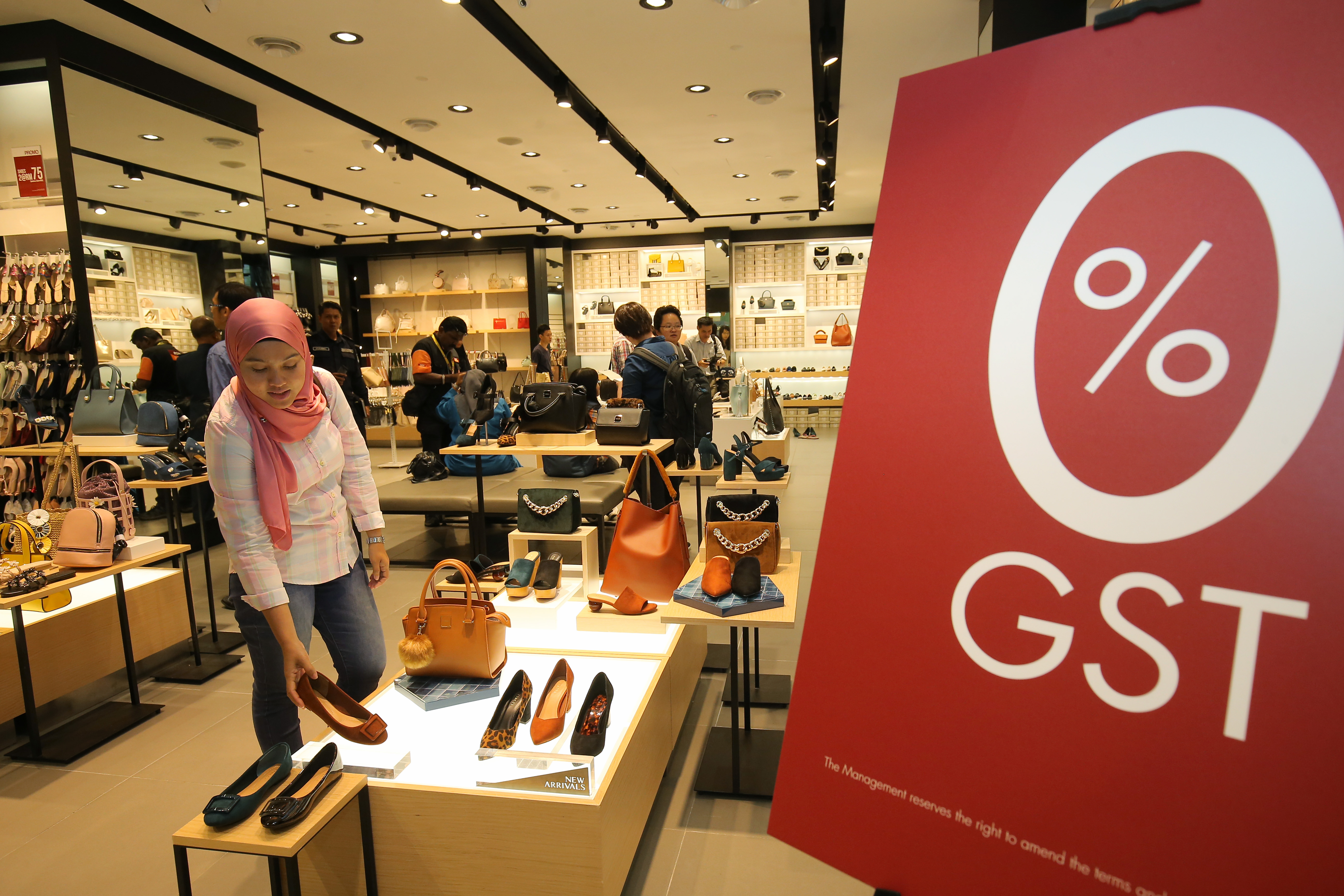 People shop at Kinta City Aeon in Ipoh June 1. u00e2u20acu201d Picture by Marcus Pheong