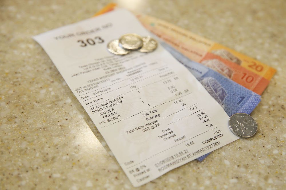 A receipt shows the zero-rated GST change that was implemented nationwide today. u00e2u20acu201d Picture by Yusof Mat Isa