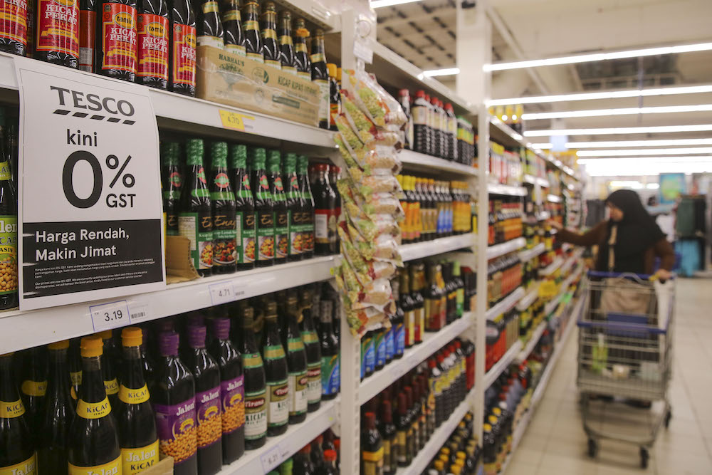 A sign announcing the zero-rated GST change is seen at a supermarket. — Picture by Yusof Mat Isa