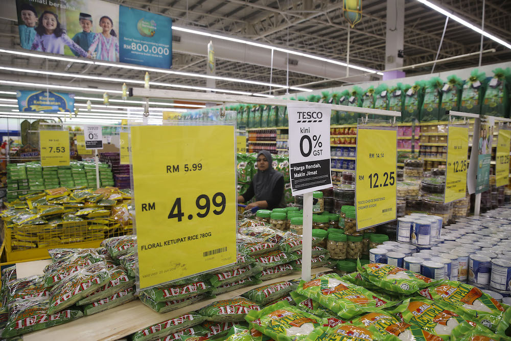 A sign announcing the zero-rated GST change is seen at a supermarket. u00e2u20acu201d Picture by Yusof Mat Isa