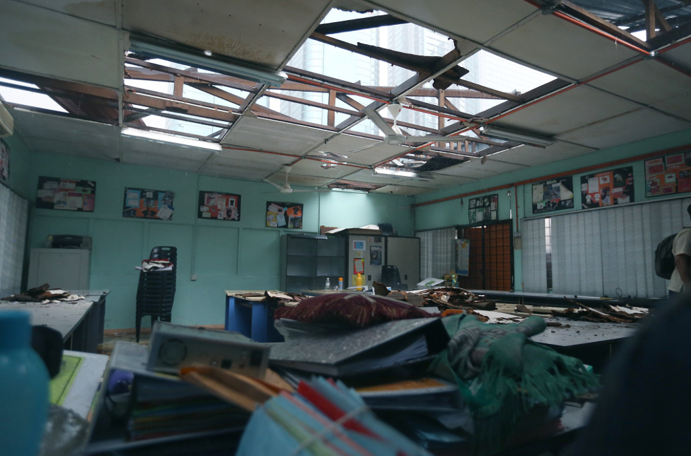The damaged SMK Seri Pantai roof is seen after it was hit by storm in Kuala Lumpur June 23, 2018.