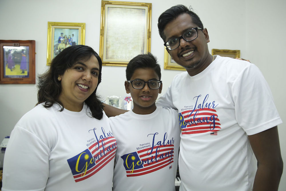 Ervin Devadason and his parents, Edward Devadason and Thayanee Rajamanoharan, pose for a photo at their house in Shah Alam June 23, 2018. u00e2u20acu201d Picture by Yusof Mat Isa