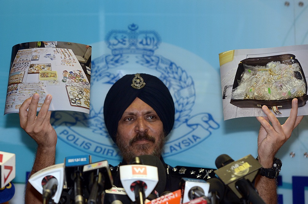Datuk Seri Amar Singh displays photos of some of the valuables seized in the raids conducted on Datuk Seri Najib Razaku00e2u20acu2122s properties, in Kuala Lumpur June 27, 2018. u00e2u20acu201d Picture by Mukhriz Hazim