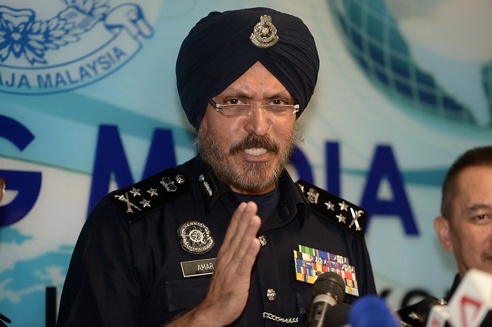Bukit Aman Commercial Crime Investigation Department director Commissioner Datuk Seri Amar Singh speaks during a press conference in Kuala Lumpur June 27, 2018. u00e2u20acu201d Picture by Mukhriz Hazim
