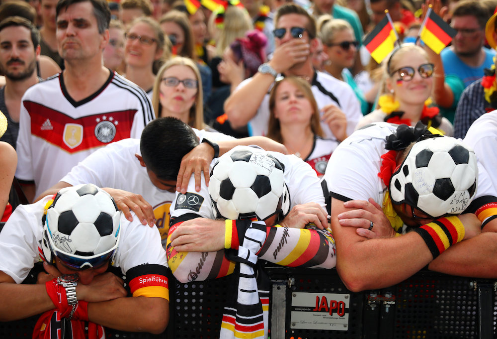 Germany fans react as they watch the 2018 Fifa World Cup match against South Korea at a public viewing area at Brandenburg Gate in Berlin June 27, 2018. 