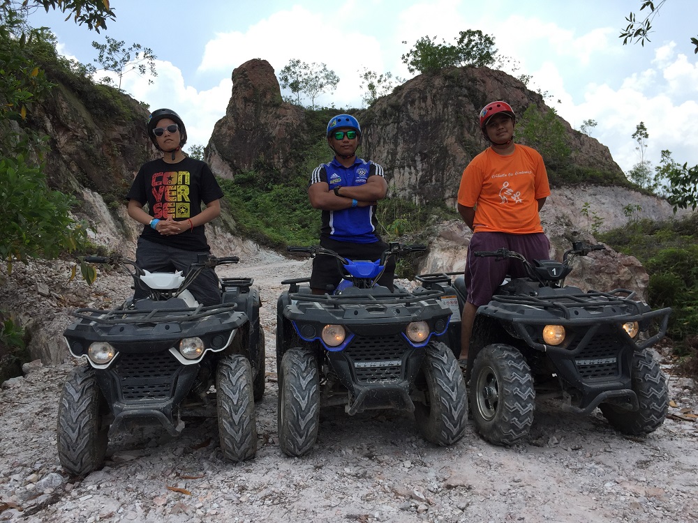 The writer (centre) had some fun at the ATV track in the resort. — Picture courtesy of Tadom Hill Resorts