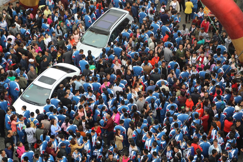 Students gather and wait to be taken to the venue for the annual national college entrance examination, or u00e2u20acu02dcgaokaou00e2u20acu2122, while their parents see them off in Dandong, Liaoning province, China, June 5, 2018. u00e2u20acu201d Reuter pic