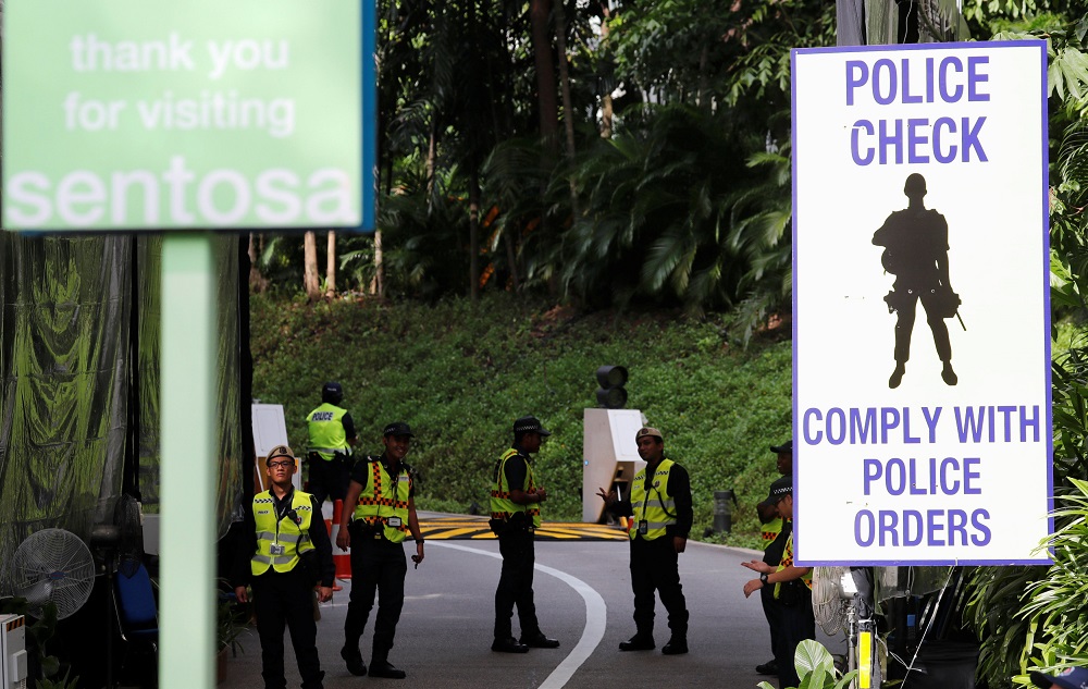 Policemen and Auxiliary police stand guards at an entrance to Capella Hotel on Sentosa Island in Singapore June 11, 2018. u00e2u20acu201d Reuters pic