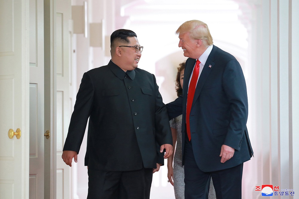 US President Donald Trump walks with North Korean leader Kim Jong-un at the Capella Hotel on Sentosa island in Singapore in this picture released on June 12, 2018. u00e2u20acu201d Reuters pic  