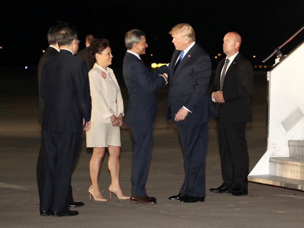 US President Donald Trump is met by Singapore's Foreign Minister Vivian Balakrishnan and other officials after arriving in Singapore June 10, 2018. u00e2u20acu201d Reuters pic
