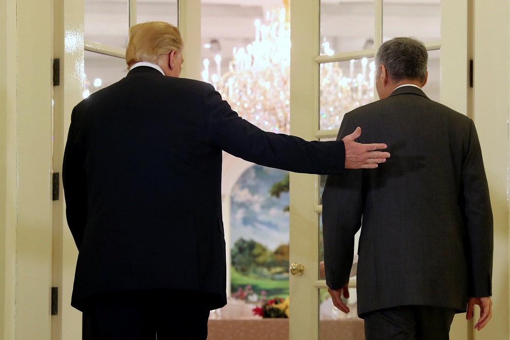 US President Donald Trump and Singapore's Prime Minister Lee Hsien Loong walk together during a meeting at the Istana in Singapore June 11, 2018. u00e2u20acu201d Reuters pic