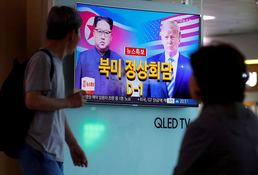 People watch a TV broadcasting a news report on the upcoming summit between the U.S. and North Korea, in Seoul, South Korea, June 11, 2018. u00e2u20acu201d Reuters pic