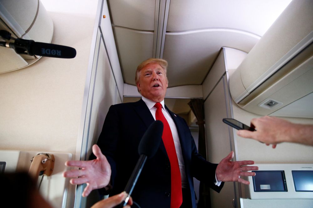 US President Donald Trump speaks to the press aboard Air Force One en route to Bedminster, New Jersey, from Joint Base Andrews, Maryland, US, June 30, 2018. u00e2u20acu201d Reuters pic