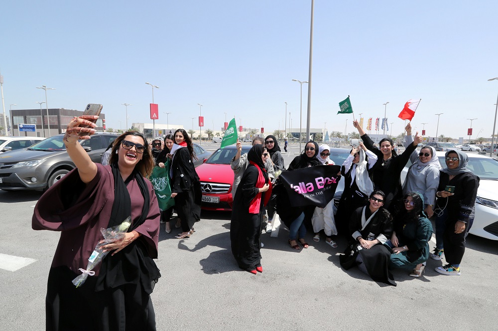 Bahraini woman Eman Mohammed takes a selfie with her phone as she celebrates with Saudi and Bahraini women the lifting of the driving ban on women, in east Saudi Arabia, June 24, 2018. u00e2u20acu201d Reuters pic