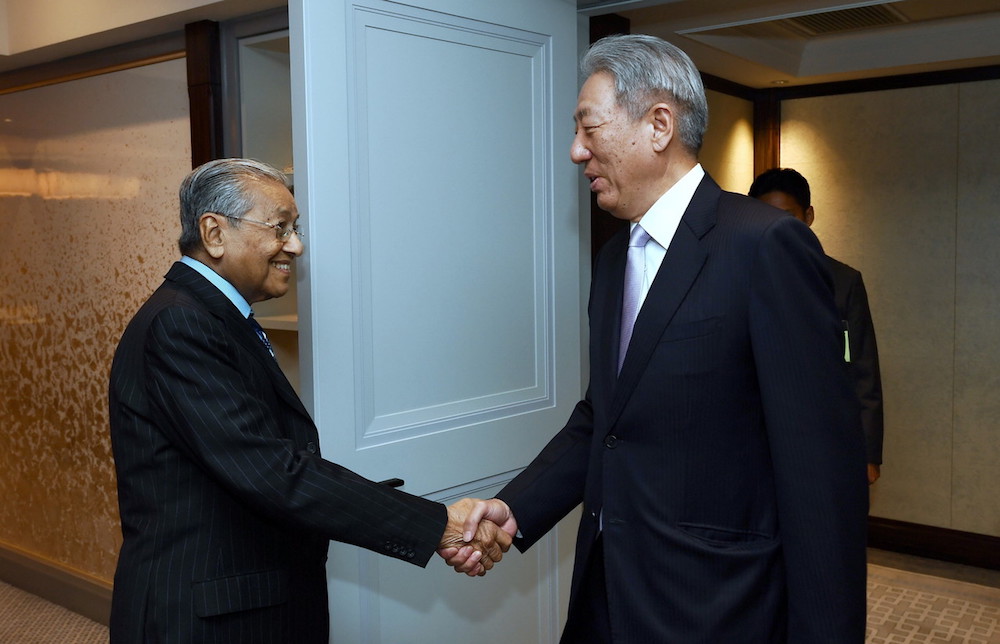 Prime Minister Tun Dr Mahathir Mohamad and Singapore Deputy Prime Minister Teo Chee Hean shakes hands before a meeting in Tokyo June 11, 2018. u00e2u20acu201d Bernama pic