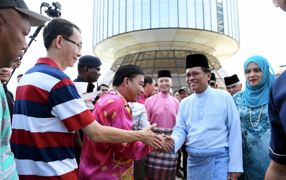 Sabah Chief Minister Datuk Seri Mohd Shafie Apdal shakes hands with people at the Sabah Cabinet ministersu00e2u20acu2122 Aidifitri open house in Kota Kinabalu June 17, 2018. u00e2u20acu201d Bernama pic