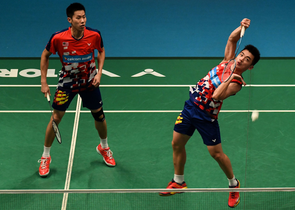 Malaysiau00e2u20acu2122s Goh V Shem and Tan Wee Kiong in action against Chinau00e2u20acu2122s Liu Cheng and Zhang Nan in the second round of the Celcom Axiata Malaysia Open 2018 in Kuala Lumpur June 28, 2018. u00e2u20acu201d Bernama pic