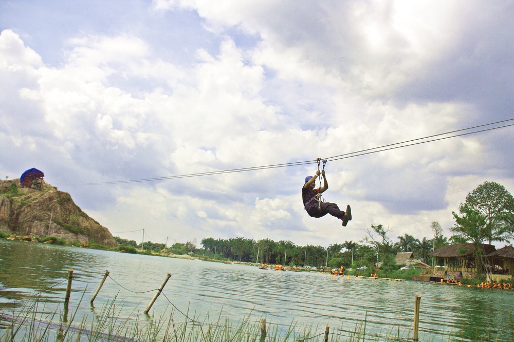 Test your guts out with a zipline which stretches over the lake. — Picture courtesy of Tadom Hill Resorts