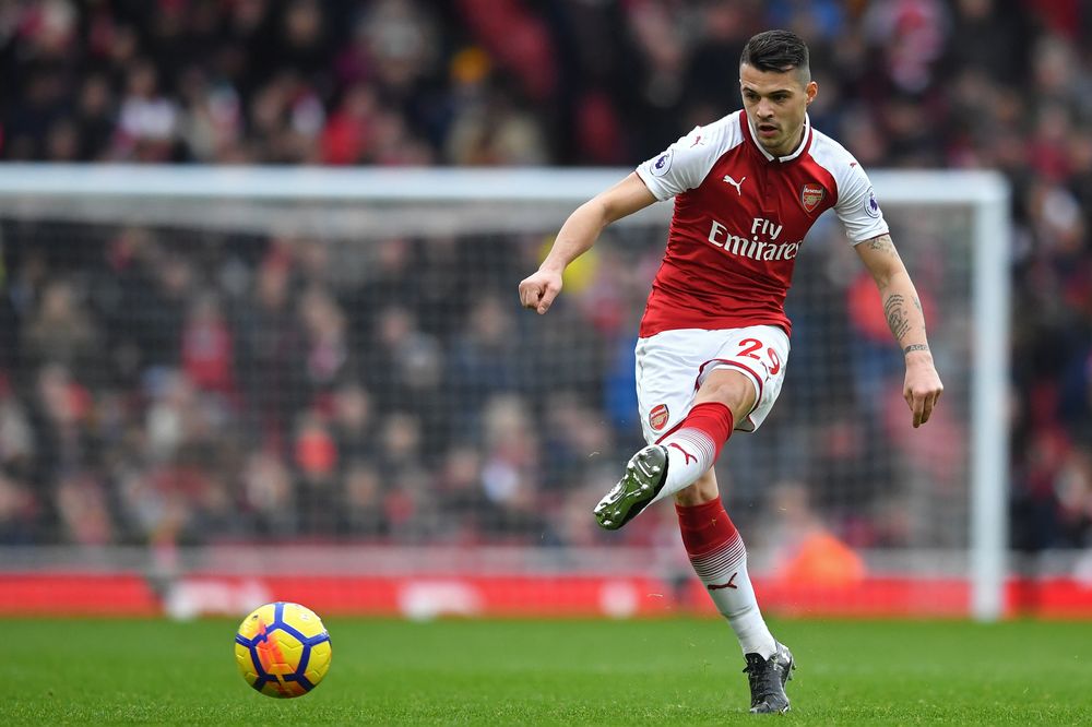 File picture shows Arsenalu00e2u20acu2122s Swiss midfielder Granit Xhaka passing the ball during their English Premier League match vs Watford at the Emirates Stadium in London, March 11, 2018. u00e2u20acu201d AFP pic