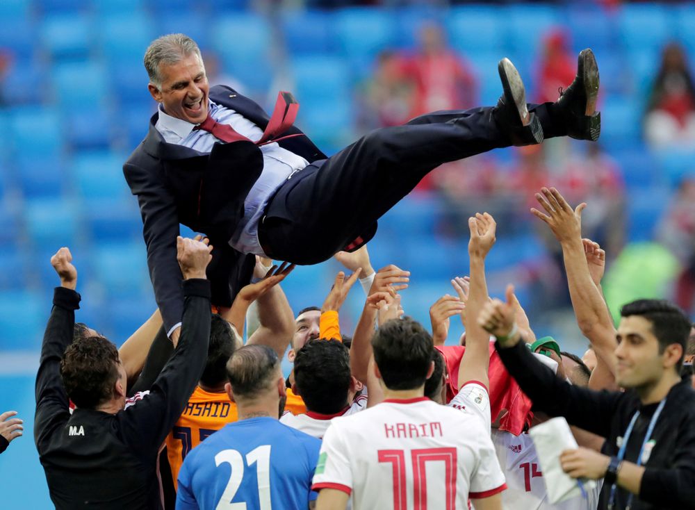 Iran players lift coach Carlos Queiroz as they celebrate after their World Cup Group B match against Morocco in Saint Petersburg Stadium, Saint Petersburg, Russia u00e2u20acu201c June 15, 2018. u00e2u20acu201d  Reuters pic