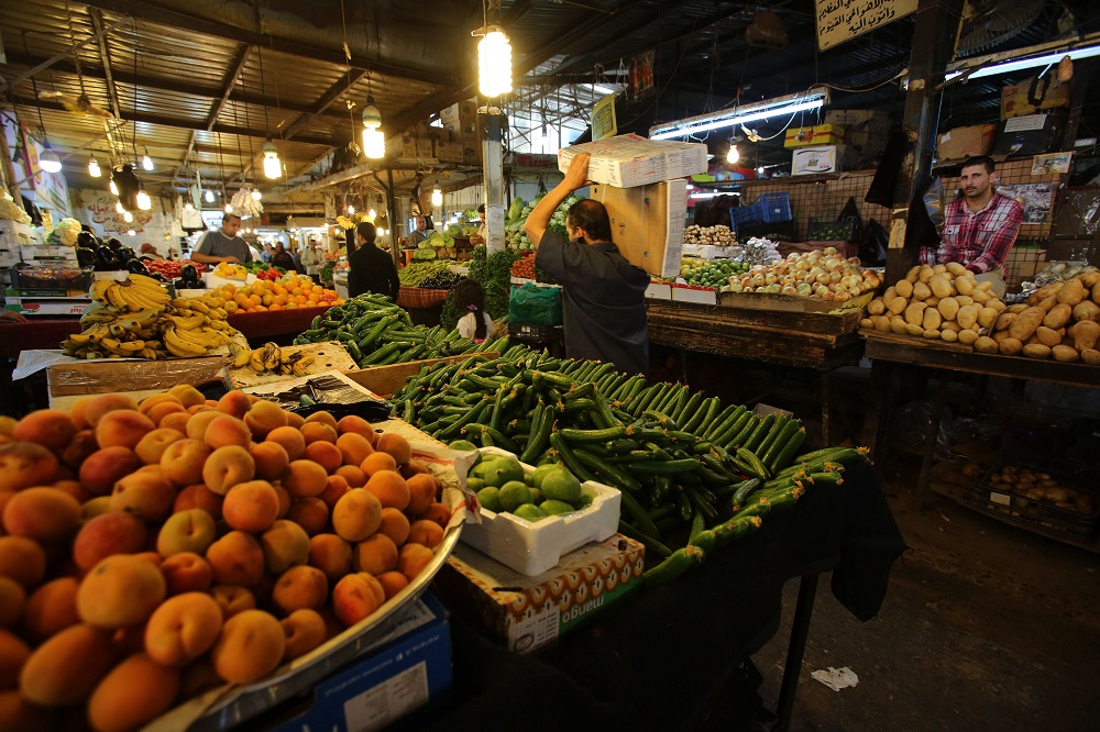 Vendors sell vegetable and fruits at a market in downtown Amman June 4, 2018. u00e2u20acu201d AFP pic