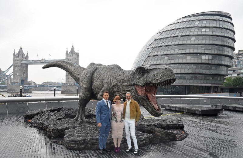 (From left) Chris Pratt, Bryce Dallas Howard and Jeff Goldblum pose in front of a model dinosaur during a photocall to promote the film 'Jurassic World: Fallen Kingdom' in London May 24, 2018. u00e2u20acu201d Reuters pic