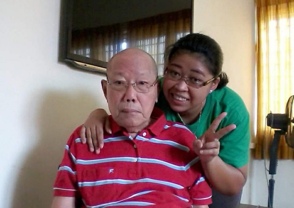 Loh Kum Mow, with his former domestic helper Tri Wahyuni, who took care of him. u00e2u20acu201d Picture courtesy of Tri Wahyuni