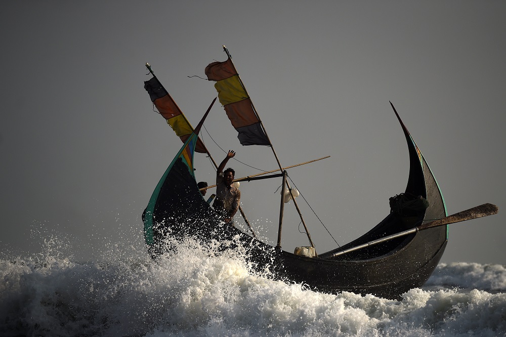 Rohingya refugees crew a fishing boat from Shamlapur beach heading out to the Bay of Bengal near Cox's Bazaar, Bangladesh March 21, 2018. u00e2u20acu201d Reuters pic
