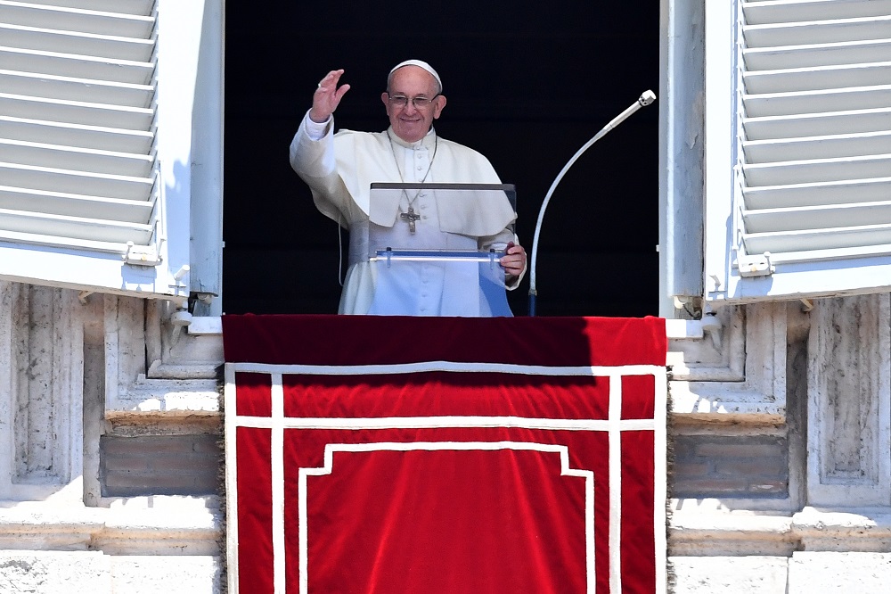 Pope Francis addresses the crowd from the window of the apostolic palace overlooking St Peter's square during his Angelus prayer on June 17, 2018 at the Vatican. u00e2u20acu201d AFP pic