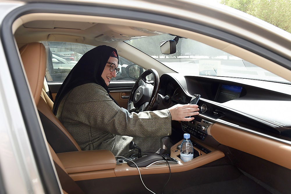 Saudi national and newly licensed Reem Farahat, an employee of Careem, a chauffeur car booking service, prepares for a customer shuttle using her car in the Saudi capital of Riyadh, on June 24, 2018. u00e2u20acu201d AFP pic