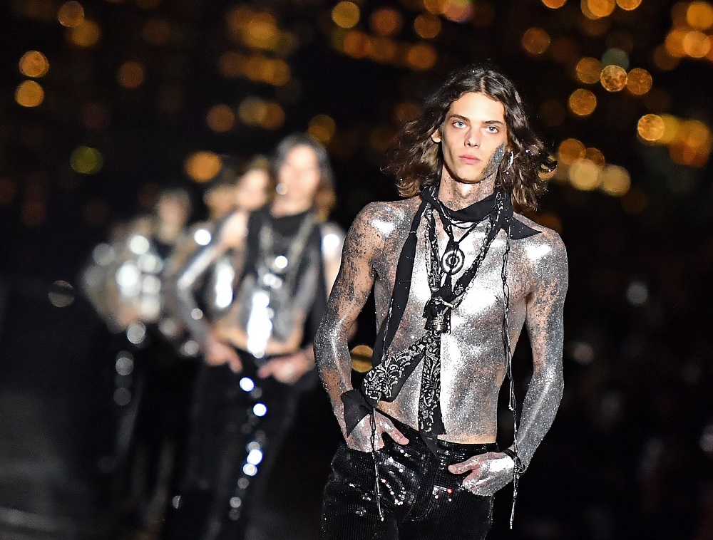 Models present creations from the Saint Laurent Men's Spring/Summer 2019 collection during a runway show in Liberty State Park on June 6, 2018 in Jersey City, New Jersey. u00e2u20acu201d AFP pic
