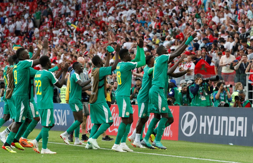 Senegal players celebrate after the winning match against Poland. u00e2u20acu2022 Reuters pic