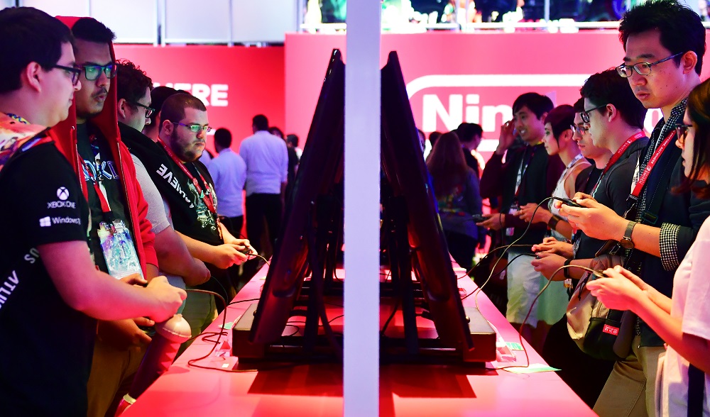 In this file photo taken on June 13, 2018 Gaming fans play Super Smash Bros on Nintendo Switch at the 24th Electronic Expo, or E3 2018, in Los Angeles, California. u00e2u20acu201d AFP pic