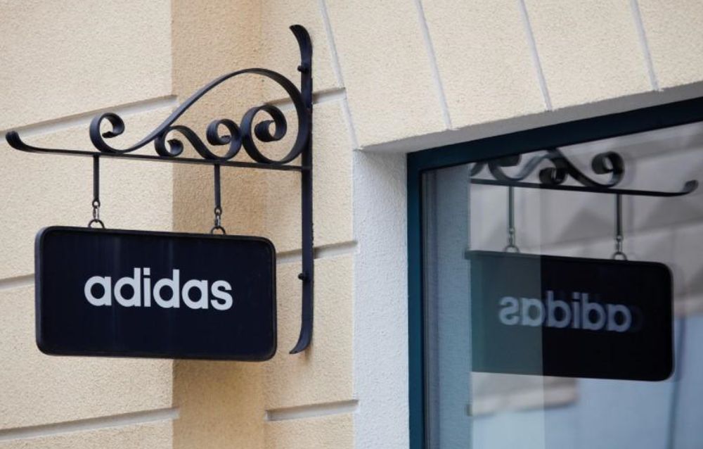 A board with Adidas store logo is seen on a shopping centre at the outlet village Belaya Dacha outside Moscow, Russia, April 23, 2016. u00e2u20acu201d Reuters pic