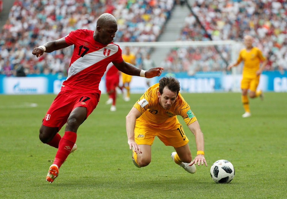 Peru's Luis Advincula (left) in action with Australia's Robbie Kruse in the World Cup Group C match in Sochi, June 26, 2018. u00e2u20acu201d Reuters pic