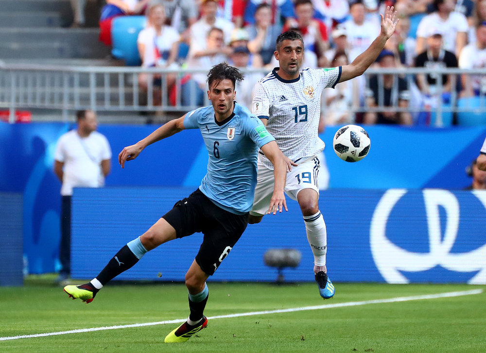 Uruguay's Rodrigo Bentancur (left) in action with Russia's Aleksandr Samedov in a World Cup Group A match in Samara June 25, 2018. u00e2u20acu201d Reuters pic 