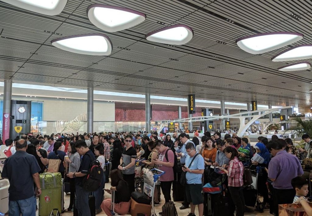 Passengers at the AirAsia check-in counters at Changi Airport Terminal 4 yesterday. u00e2u20acu201d Mayank Sardana via Twitter screengrab