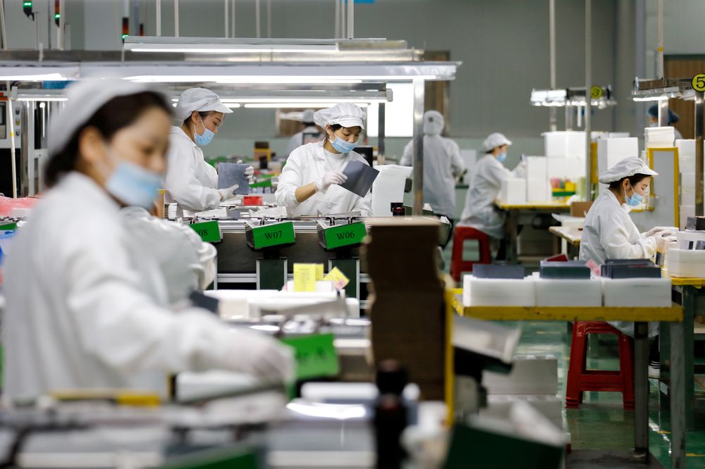 Employees work at an assembly line of a company producing solar panel components in Jiujiang, Jiangxi province, China March 16, 2018. u00e2u20acu201d Reuters pic
