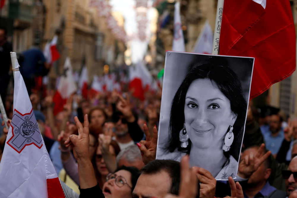A demonstrator carries a photo of murdered Maltese anti-corruption journalist Daphne Caruana Galizia in a protest in Valletta, Malta April 29, 2018. u00e2u20acu201d Reuters pic