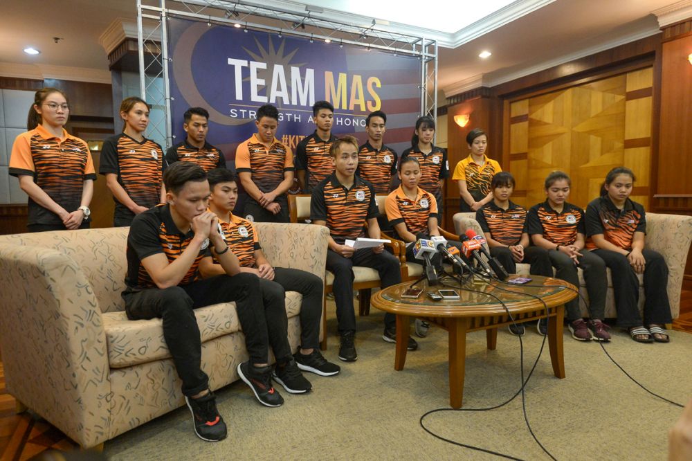 Chew Yiwei (centre) speaks during a press conference at the National Sports Council in Bukit Jalil June 21, 2018. u00e2u20acu2022 Picture by Mukhriz Hazim