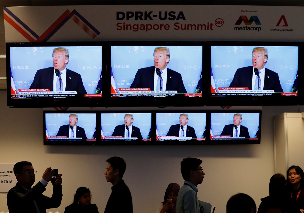 A TV news reports about US President Donald Trump is projected on TV sets at a media center for the summit between the US and North Korea in Singapore, June 10, 2018. u00e2u20acu201d Reuters pic