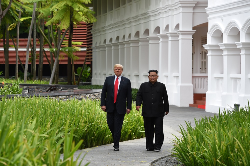 US President Donald Trump and North Korean leader Kim Jong-un walk in the Capella Hotel after their working lunch, on Sentosa island in Singapore June 12, 2018. u00e2u20acu201d Reuters pic