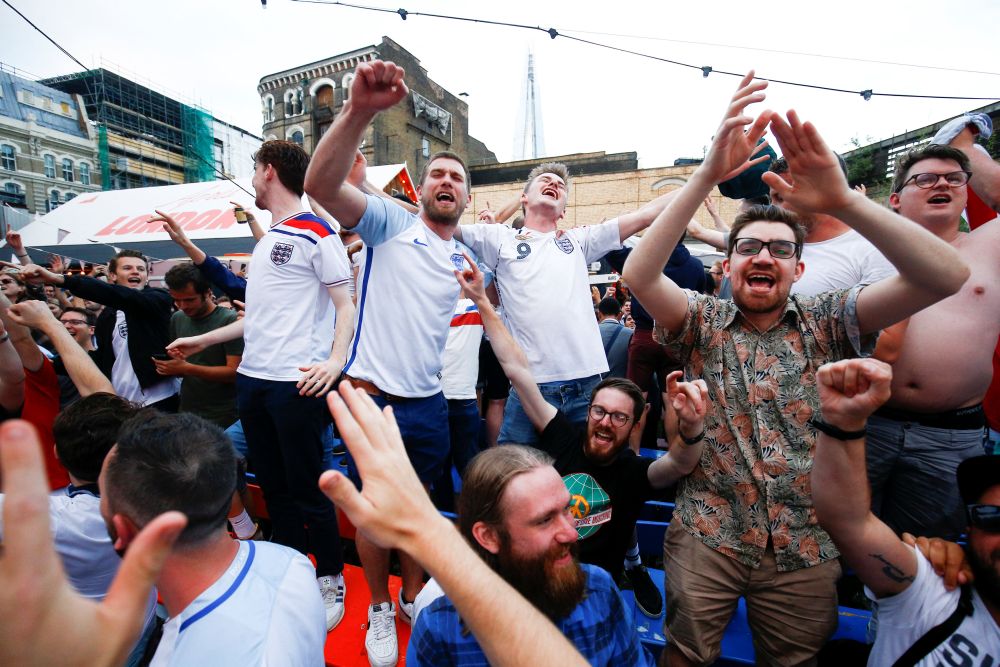 England football fans watch the team's first match in the World Cup against Tunisia at Flat Iron Square in London June 18, 2018. u00e2u20acu2022 Reuters pic