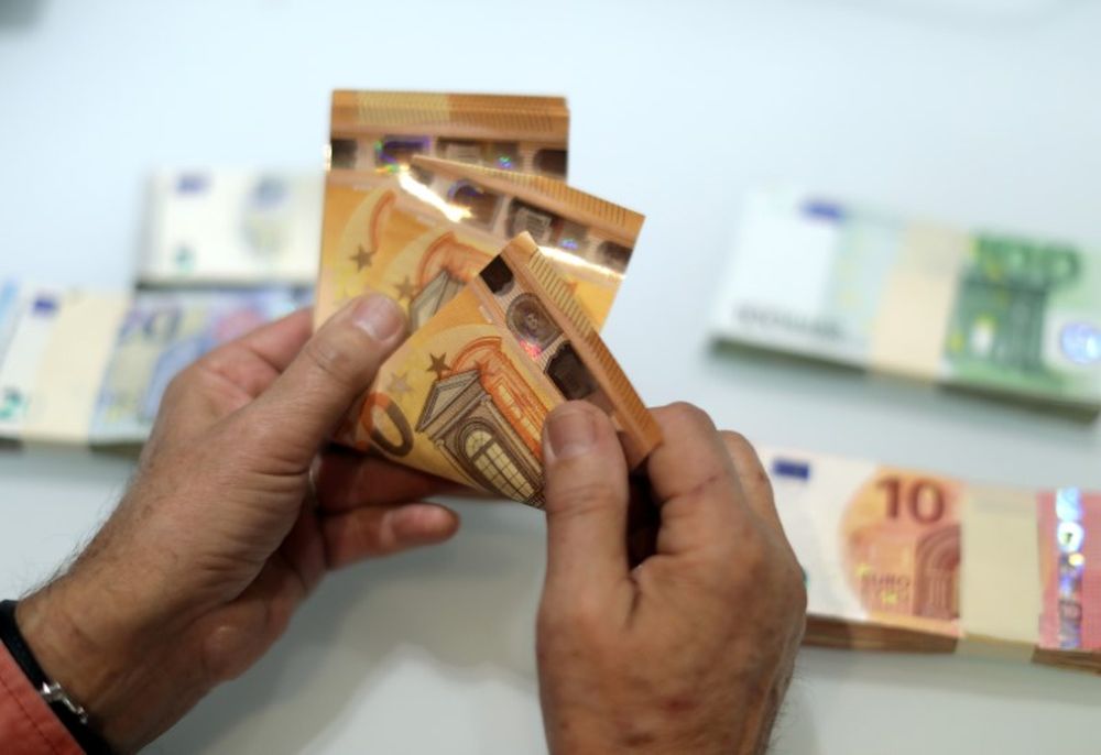 A money changer counts Euro banknotes at a currency exchange office in Nice, France November 17, 2017. u00e2u20acu201d Reuters pic