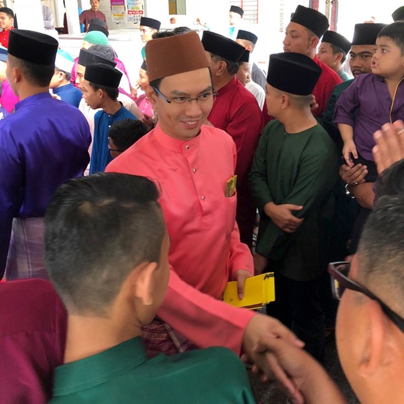 The writer meets members of the public after Friday prayers on the first day of Hari Raya. — Picture from Instagram/tz.n9
