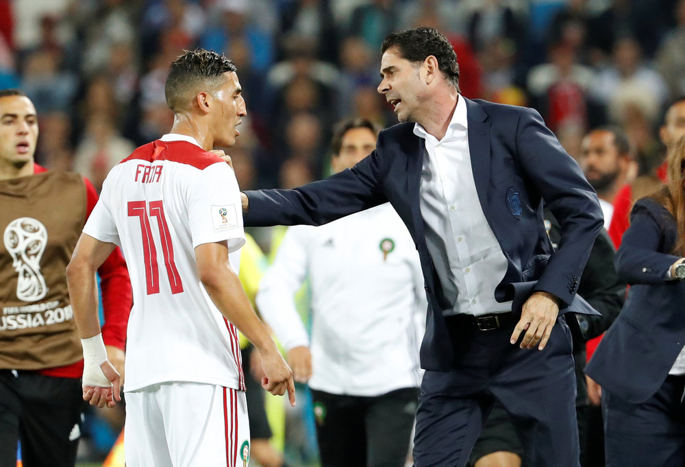 Spain coach Fernando Hierro (right) talks with Morocco's Faycal Fajr during the World Cup Group B match in Kaliningrad, June 25, 2018. u00e2u20acu201d Reuters pic 