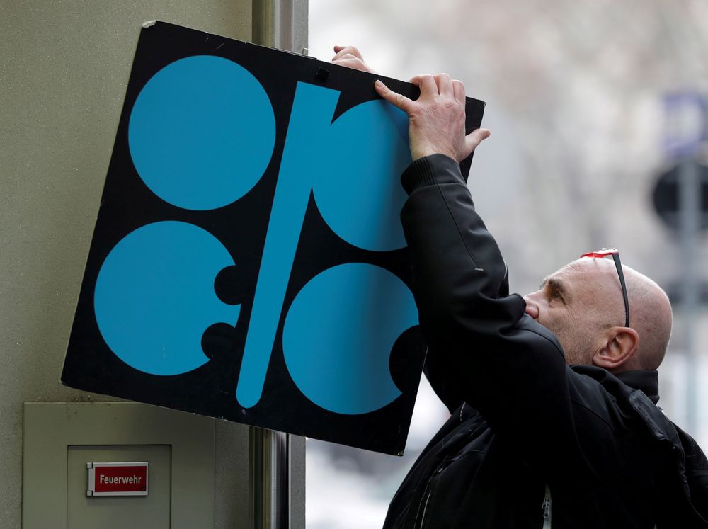 A man fixes a sign with Opecu00e2u20acu2122s logo next to its headquartersu00e2u20acu2122 entrance before a meeting of Opec oil ministers in Vienna, Austria, November 29, 2017. u00e2u20acu201dReuters pic